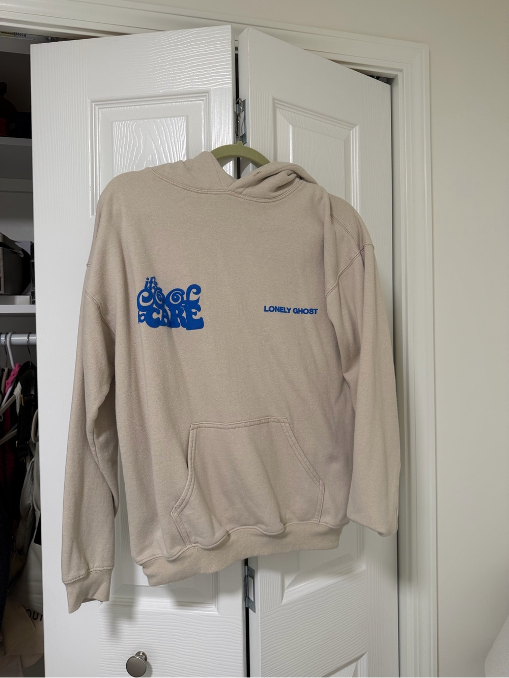 LONELY GHOST Beige Hoodie with Bold Blue Graphic